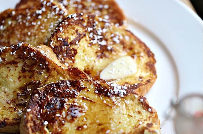 white plate with slices of cooked french bread French Toast