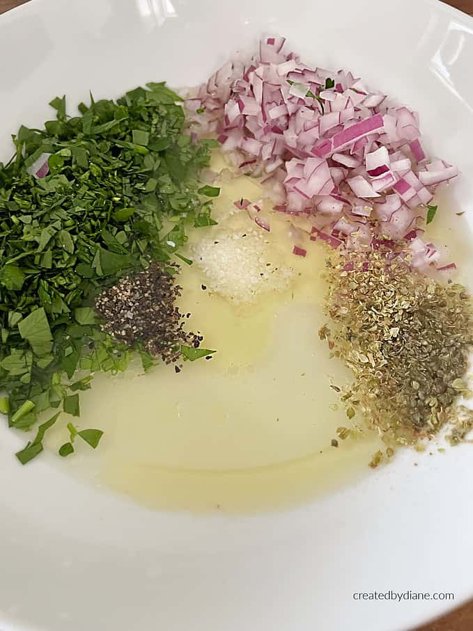 oil, lemon, garlic, onion, oregano, salt, pepper, parsley