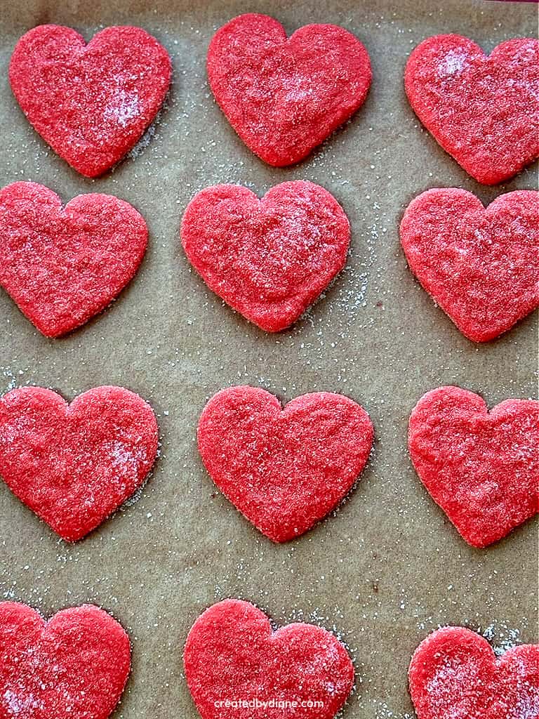 sugared cookies, crunchy and chewy options for these bright red heart sugar cookies, the ultimate to enjoy cookies, perfect for the ones you love, Valentine's Day, to enjoy as you watch your favorite shows the crunchy sugar crystals coat these cookies for an added layer of fantastic-ness!