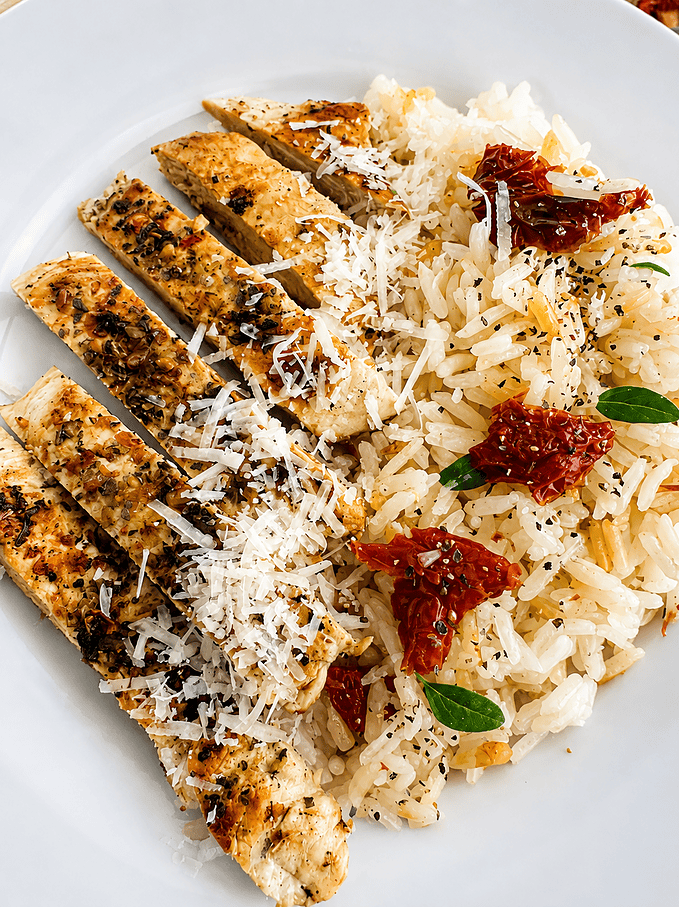 chicken with sun dried tomato rice recipe on the stove