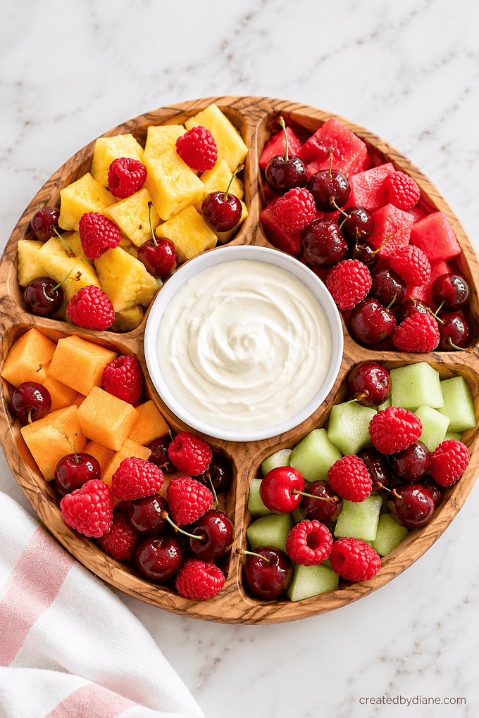 fruit platter with a homemade sweet cream cheese fruit dip, elevates fruit, looks so pretty, and the sweet cream cheese dip is amazing